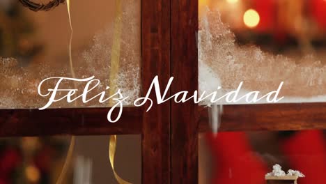 Feliz-Navidad-written-over-window-with-decorations