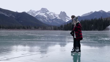 Couple-skating-on-a-frozen-lake