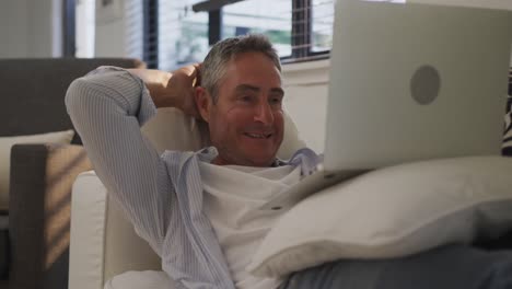Man-using-laptop-at-home