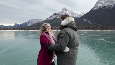Couple-skating-together-on-a-frozen-lake