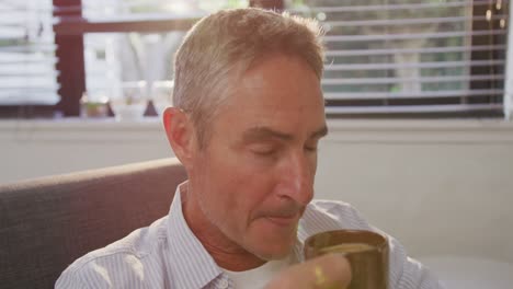 Man-drinking-coffee-at-home