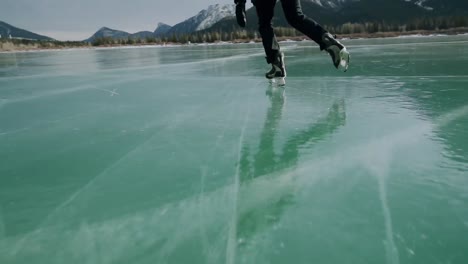 Man-skating-on-a-frozen-lake
