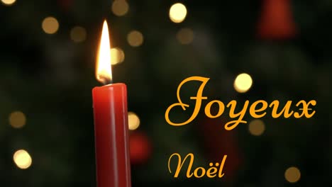 Joyeux-NoÃ«l-written-over-lit-candle
