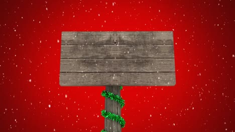 Christmas-sign-board-and-snow-falling