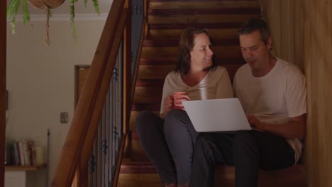 Couple-at-home-together-on-the-stairs-4k