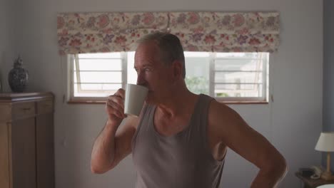 Senior-man-drinking-coffee-at-home