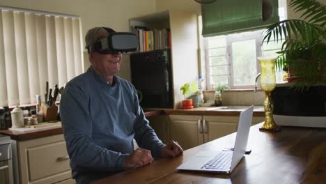 Senior-man-wearing-VR-headset-at-home