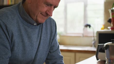Senior-man-using-digital-tablet-at-home
