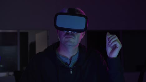 Caucasian-man-wearing-VR-headset-in-creative-office