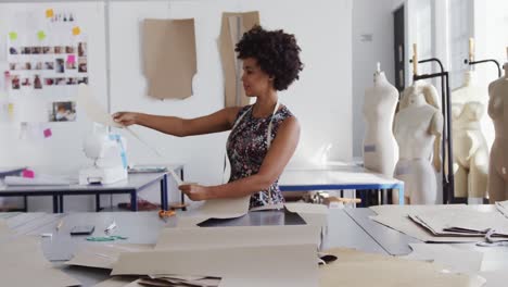 Mixed-race-woman-working-in-creative-office