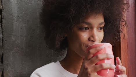Front-view-mixed-race-woman-drinking-coffee