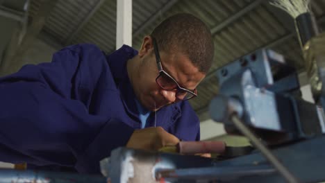 Mixed-race-man-working-in-factory