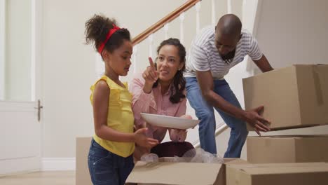 African-American-couple-and-their-daughter-moving-into-new-house