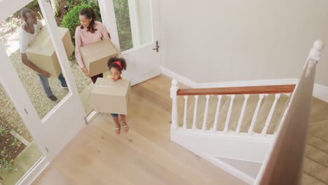 African-American-couple-and-their-daughter-moving-into-new-house