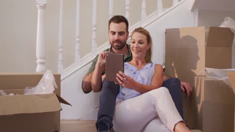 Caucasian-attractive-couple-moving-into-new-house