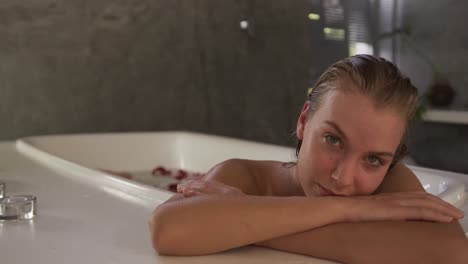 Caucasian-woman-taking-bath-in-hotel