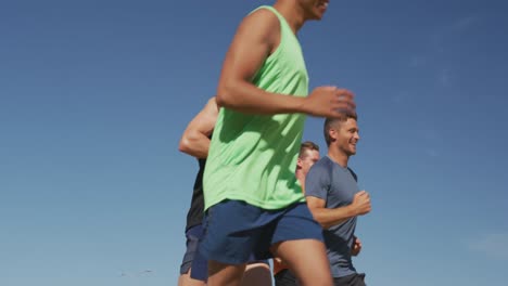 Men-running-outside-on-sunny-day