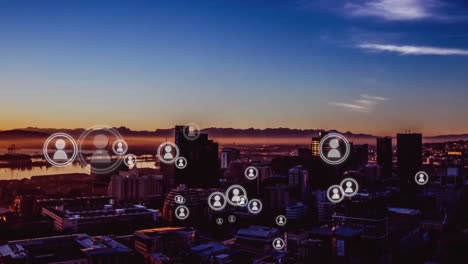Animation-of-people-icons-with-city-in-background