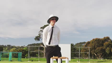 Cricket-umpire-making-signs-standing-on-a-cricket-pitch