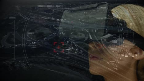 Scope-scanning-against-woman-using-virtual-reality-headset-and-aerial-city-view