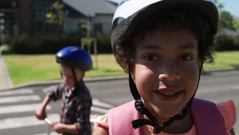 Girl-wearing-helmet-smiling-on-the-road