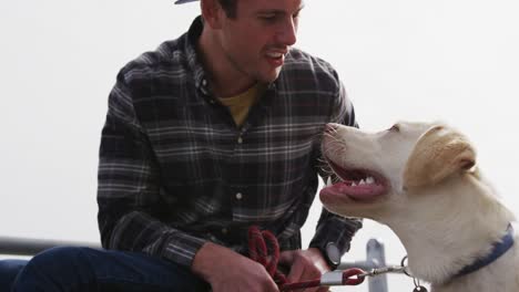 Man-in-a-wheelchair-enjoying-free-time-with-his-dog