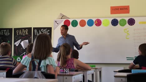 Male-teacher-teaching-in-the-class
