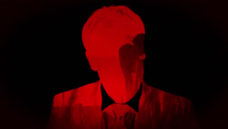Mann-Mit-Rotem-Licht-Und-Zwei-Silhouetten,-Die-Sich-Auf-Schwarzem-Hintergrund-Küssen