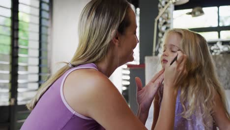 Mother-making-up-her-daughter