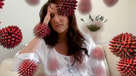 Animation-of-red-corona-virus-with-sick-woman-in-background