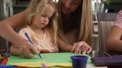 Mother-and-daughters-painting-together