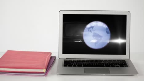 News-screen-with-digital-globe-spinning-on-laptop-screen