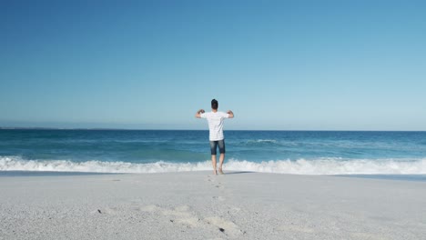 Man-standing-on-the-beach