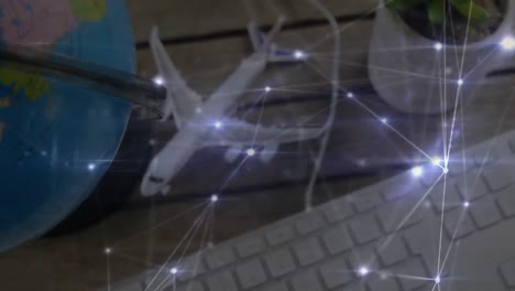 Animation-of-global-network-of-connections-with-model-aeroplane-on-desk-and-a-globe