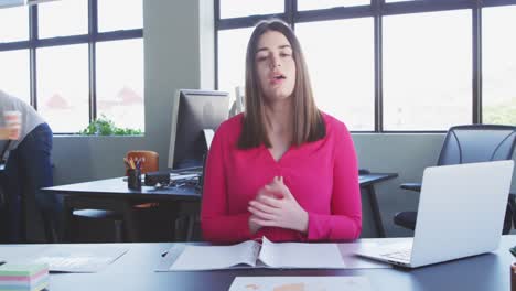 Businesswoman-interviewing-someone-in-modern-office