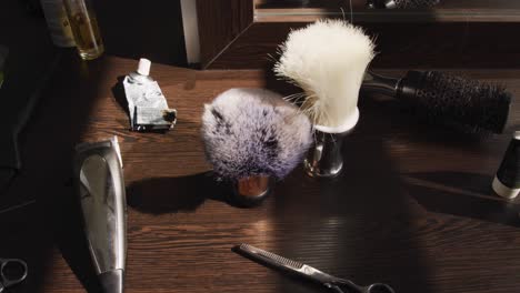 Close-up-view-of-hairdresser-utensils-on-table