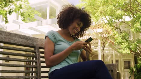 Mixed-race-woman-using-his-phone