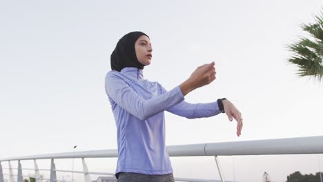 Woman-wearing-hijab-stretching-outside
