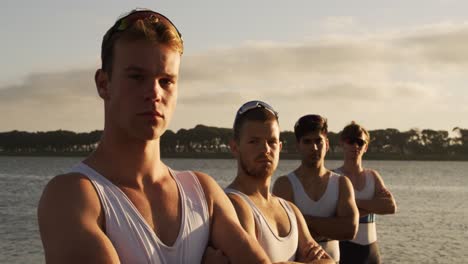 Male-rower-team-looking-at-camera-with-arms-crossed