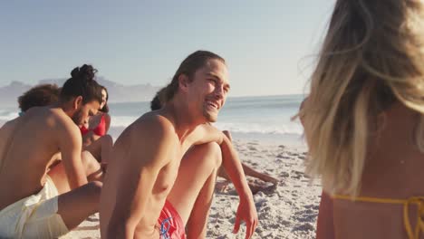Friends-talking-and-laughing-at-beach