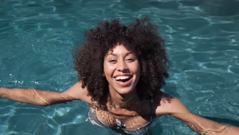 Mixed-race-woman-enjoying-her-time-in-a-pool
