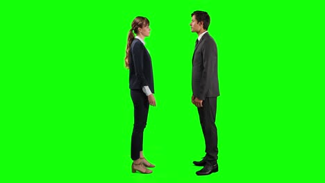 Side-view-of-business-people-making-a-deal-and-shaking-their-hands-with-green-screen