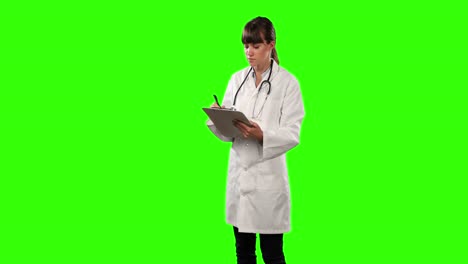 Side-view-of-a-female-doctor-checking-some-results-with-green-screen