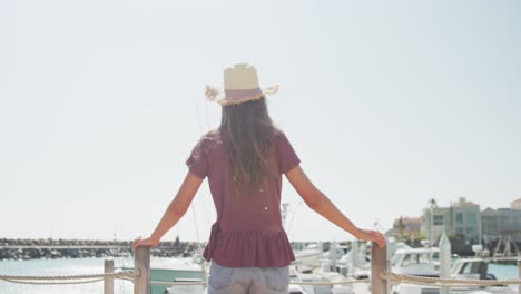 Rear-view-of-a-teenage-Caucasian-girl-harbour-side