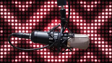 Animation-of-microphone-over-red-glowing-lights-of-digital-display-in-the-background