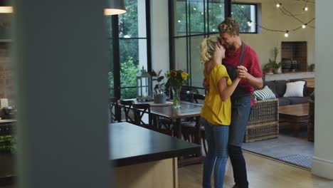 Happy-couple-dancing-in-the-kitchen