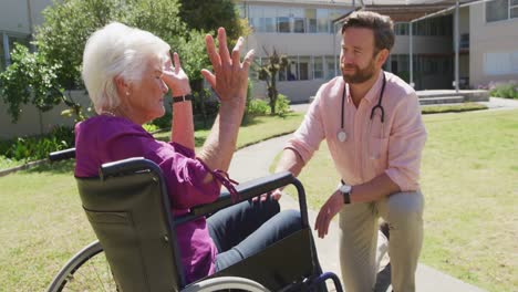 Doctor-with-a-senior-woman-in-the-park-of-a-retirement-home