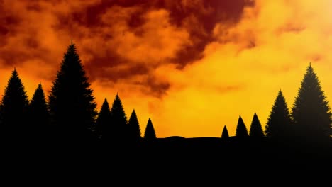 Animation-of-orange-and-yellow-clouds-over-black-silhouettes-of-trees