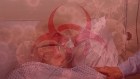 Hazard-sign-and-Covid-19-spreading-over-a-senior-patient-wearing-an-oxygen-mask-in-background