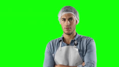 Caucasian-man-with-an-apron-on-a-green-background